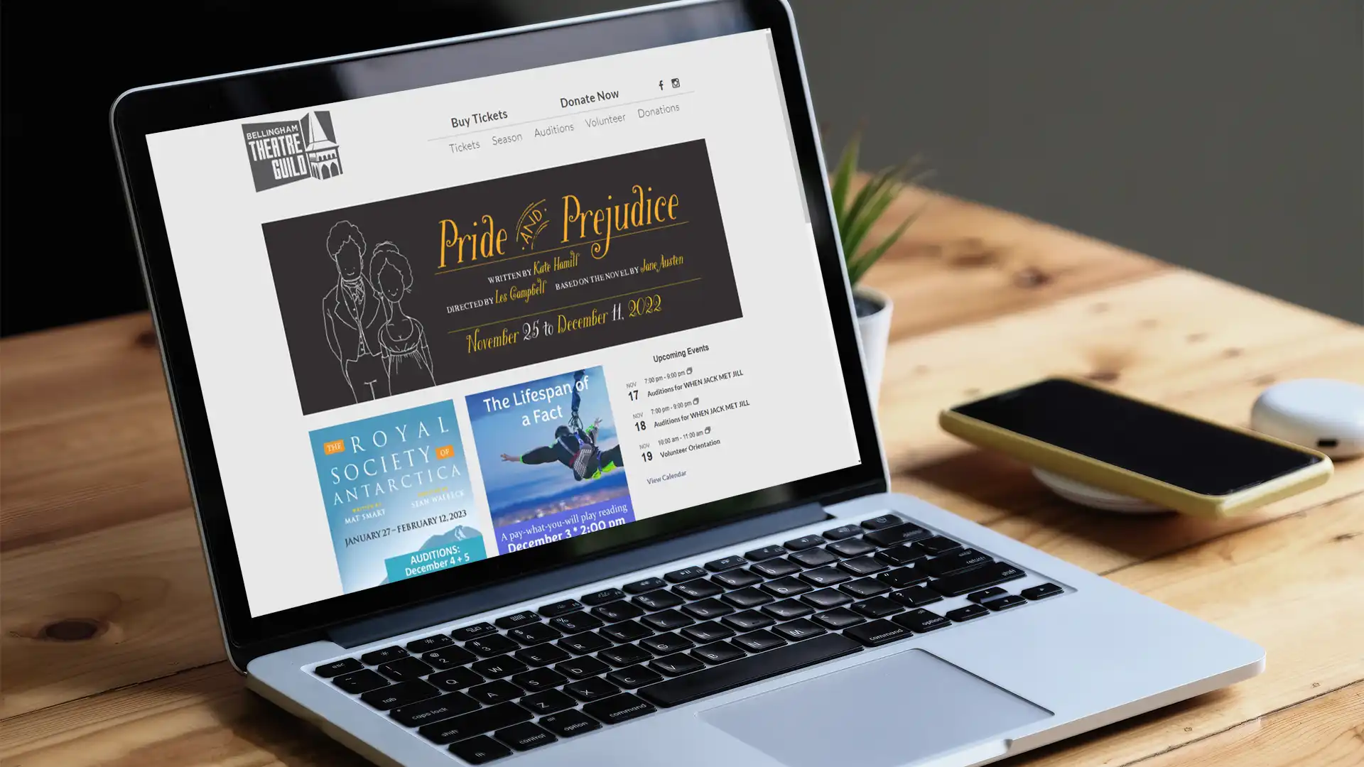 Bellingham Theatre Guild website on a laptop